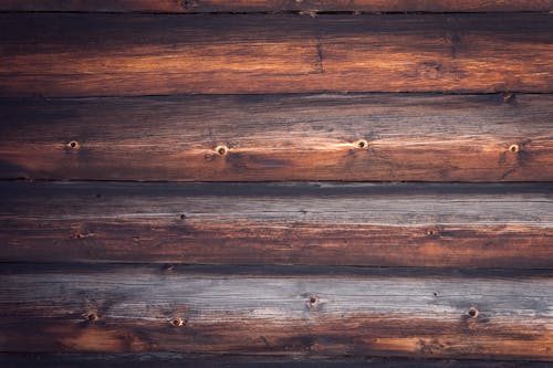Free Top view element of natural wooden wall surface with brown horizontal timber panels as abstract background Stock Photo
