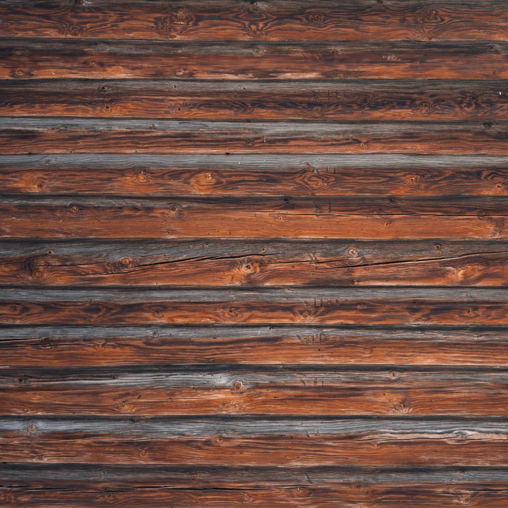Fence and Decking Painting in Clapham Junction — a decorator at work mid-project