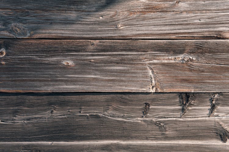 Weathered Wooden Surface With Scratches On Sunny Day