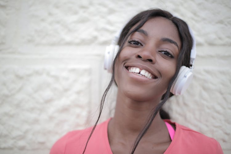 Happy African American Female Listening To Music