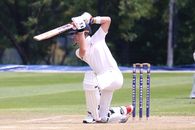 Man in White Jersey Shirt and White Pants Playing Cricket