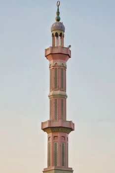 Detailed view of a mosque minaret in Sharjah showcasing intricate Islamic architecture.