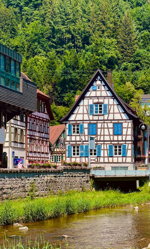 Free Traditional half-timbered houses in Schiltach, Germany by a serene river. Stock Photo