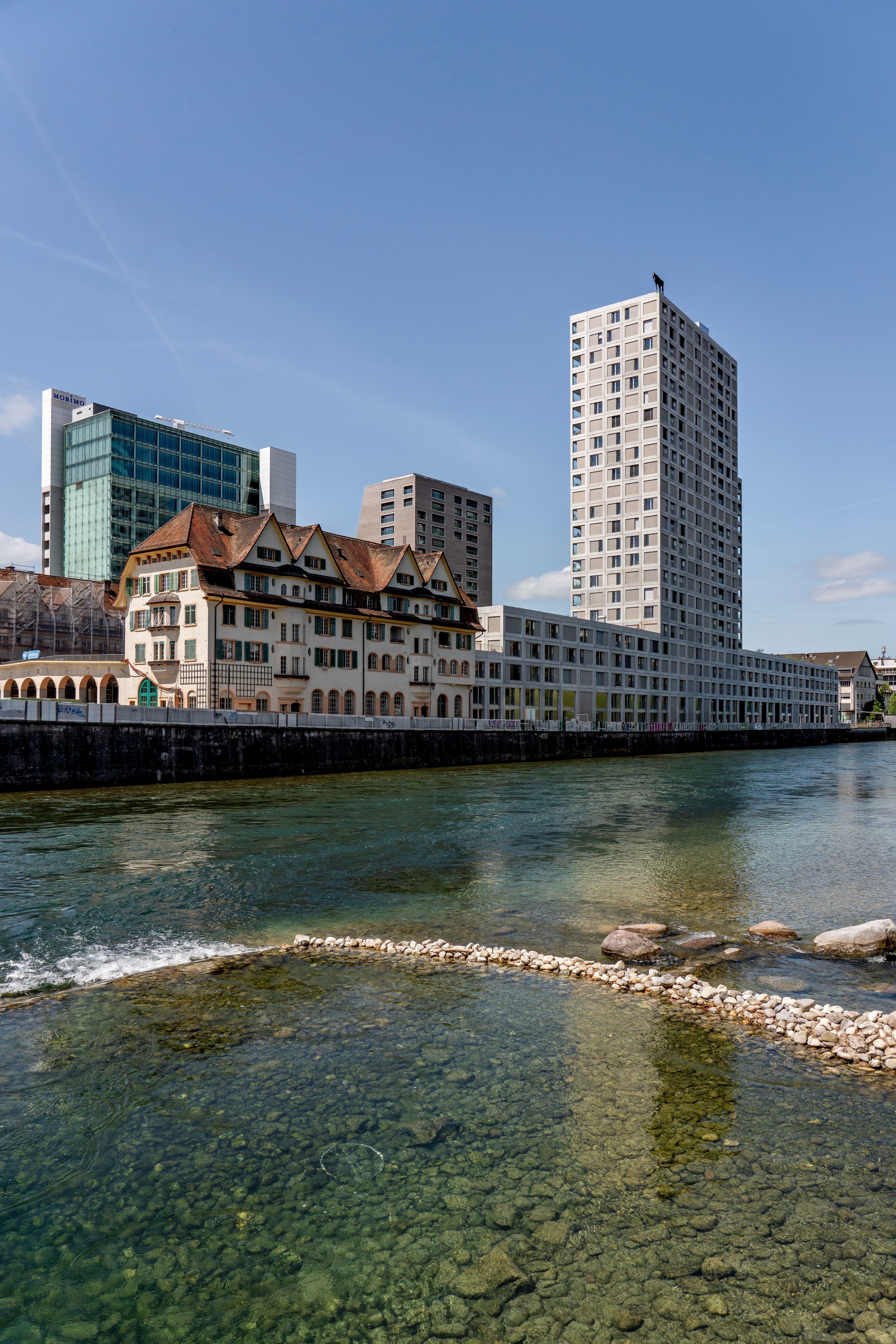 Captivating mix of modern and historic buildings along the river in Zurich, Switzerland.