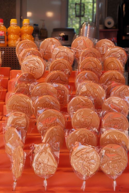 Free A vibrant display of traditional Korean dalgona candy in a street market. Stock Photo