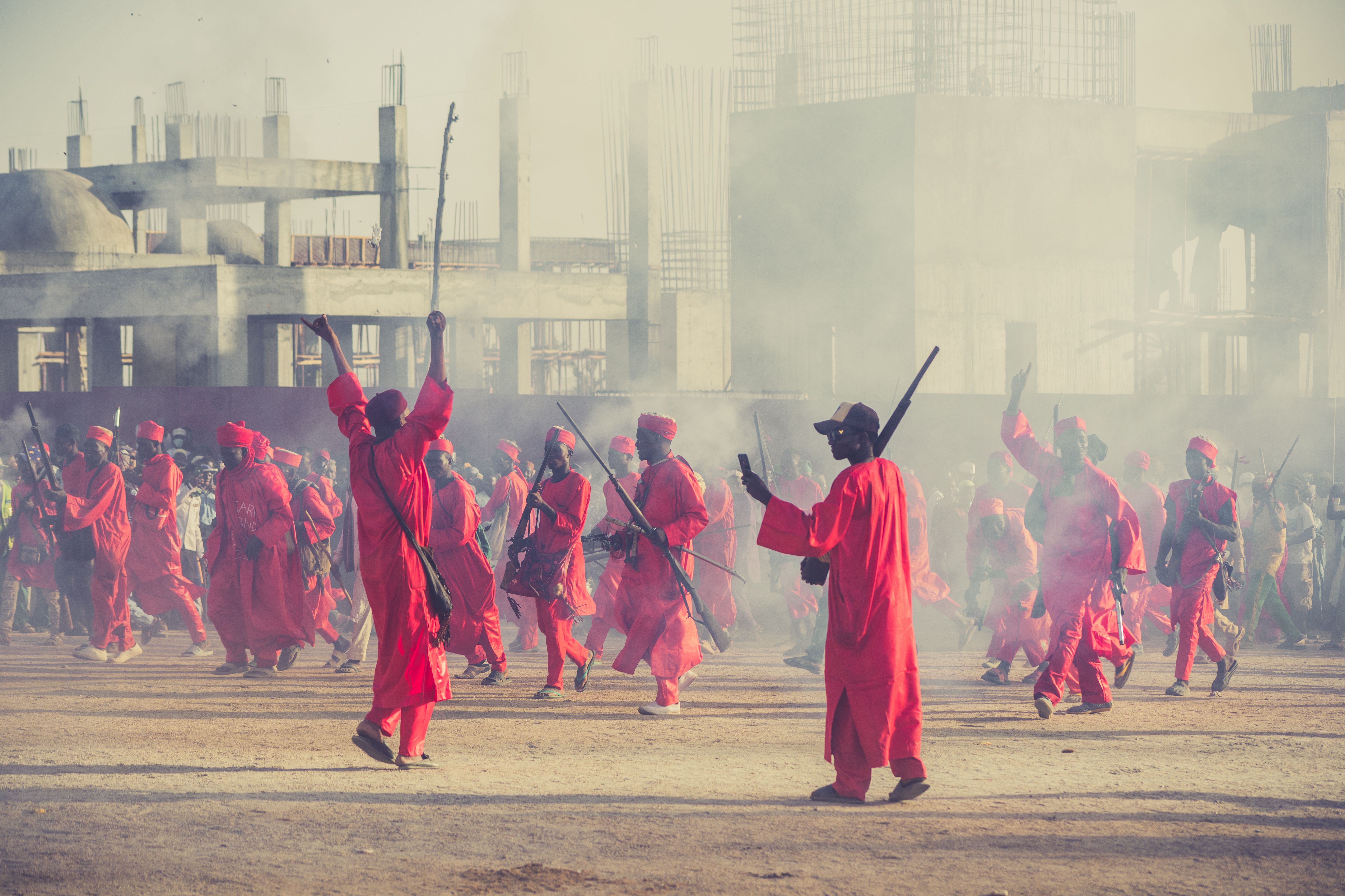 Colorful traditional parade with red attire, South Sudan