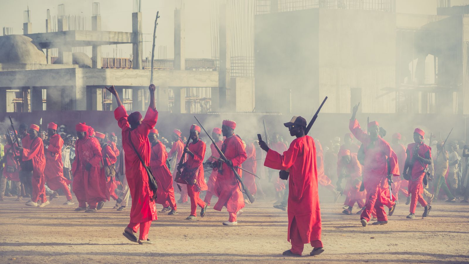 Colorful traditional parade with red attire, South Sudan