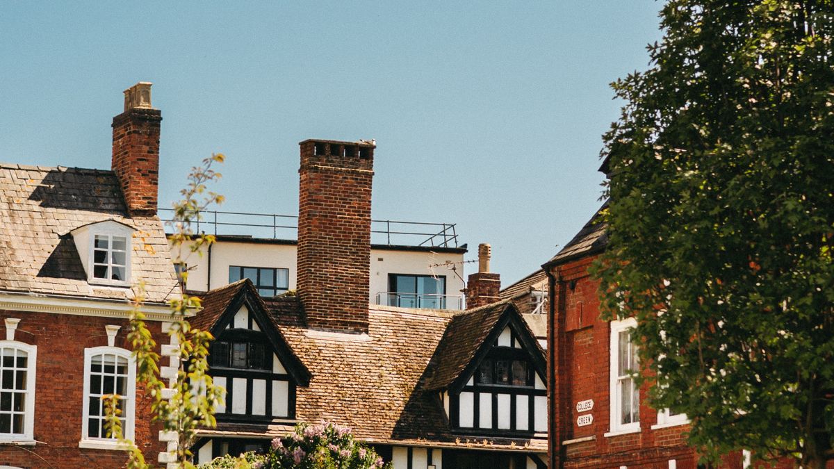 Red-brick and timber-framed buildings in Gloucester on a sunny day