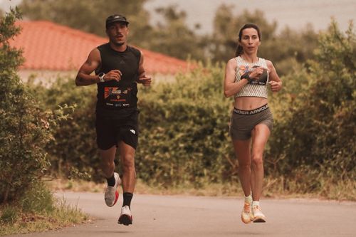 Free A man and woman jogging on an outdoor path, showcasing fitness and healthy lifestyle. Stock Photo