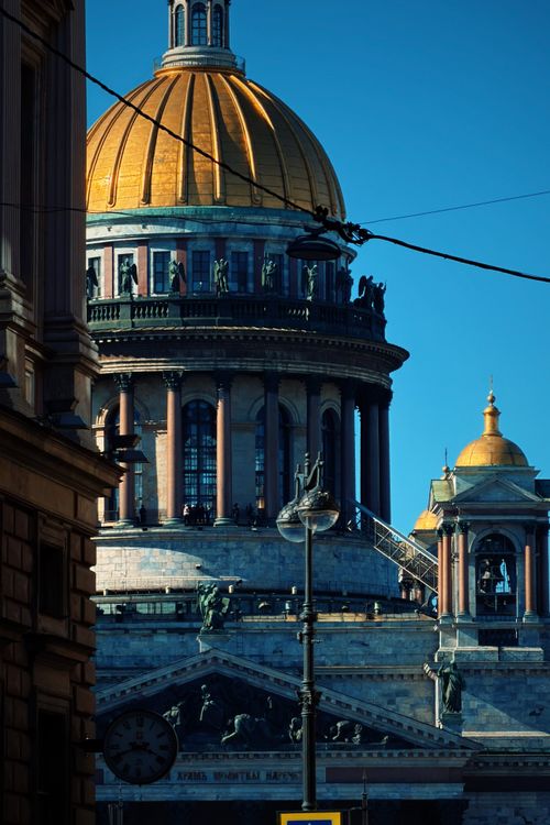 Free Majestic view of St. Isaac's Cathedral with its golden dome shining under clear blue skies. Stock Photo