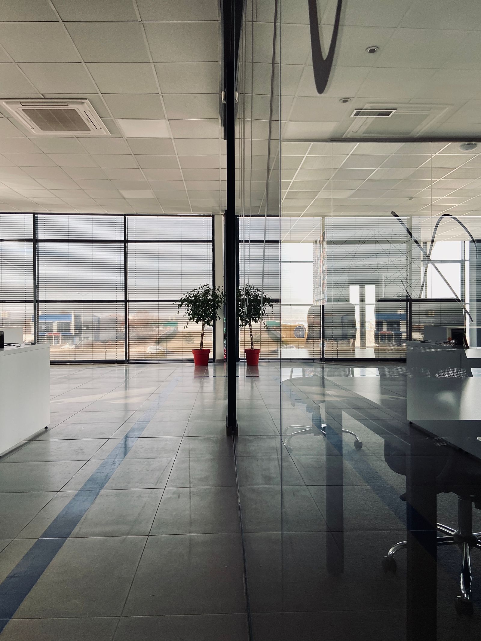 Modern office interior with glass partitions and natural light