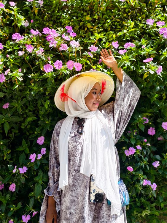 Woman in Traditional Dress Amidst Blooming Flowers · Free Stock Photo