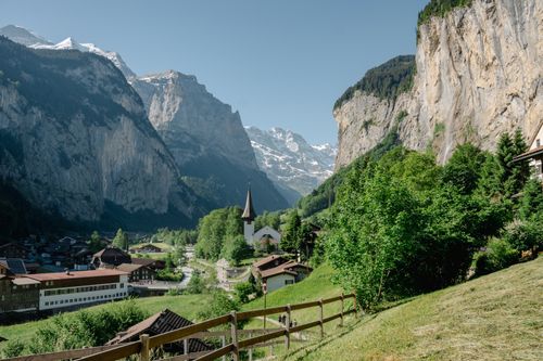 A picturesque view of the Lauterbrunnen Valley with alpine landscape and charming village.