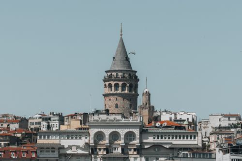Free Street view of the Galata Tower in Istanbul, Turkey against a clear blue sky. Stock Photo