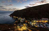 A breathtaking sunset view over Jamestown, Saint Helena, showcasing the town and harbor from above.