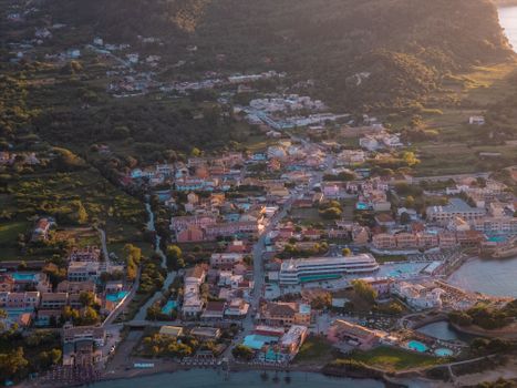 Stunning aerial view of Agios Georgios in Corfu, Greece, captured during sunset highlighting the vibrant architecture.