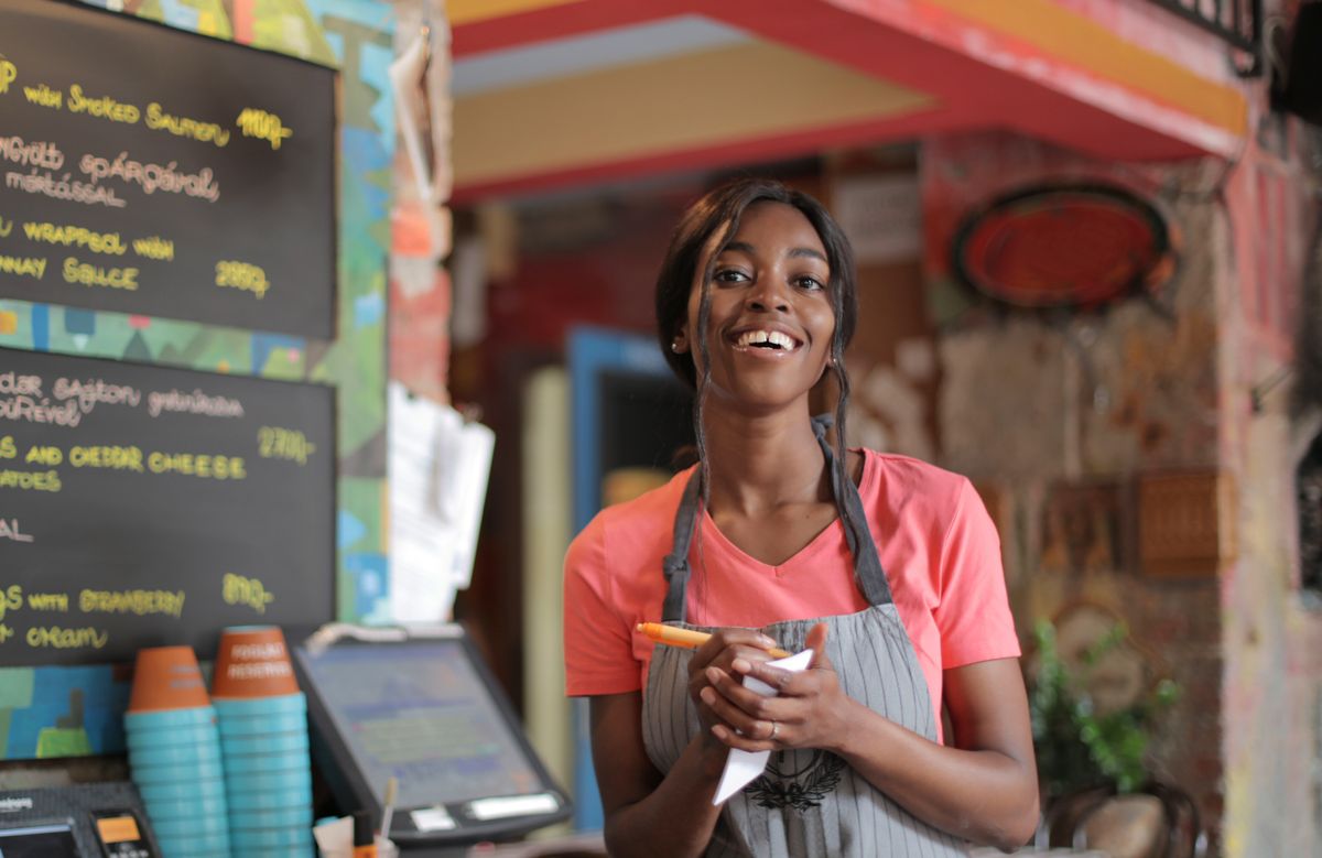 A joyful female restaurant worker