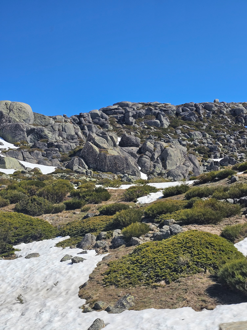 Free Scenic view of rocky terrain and snow patches at Serra da Estrela, Portugal. Stock Photo