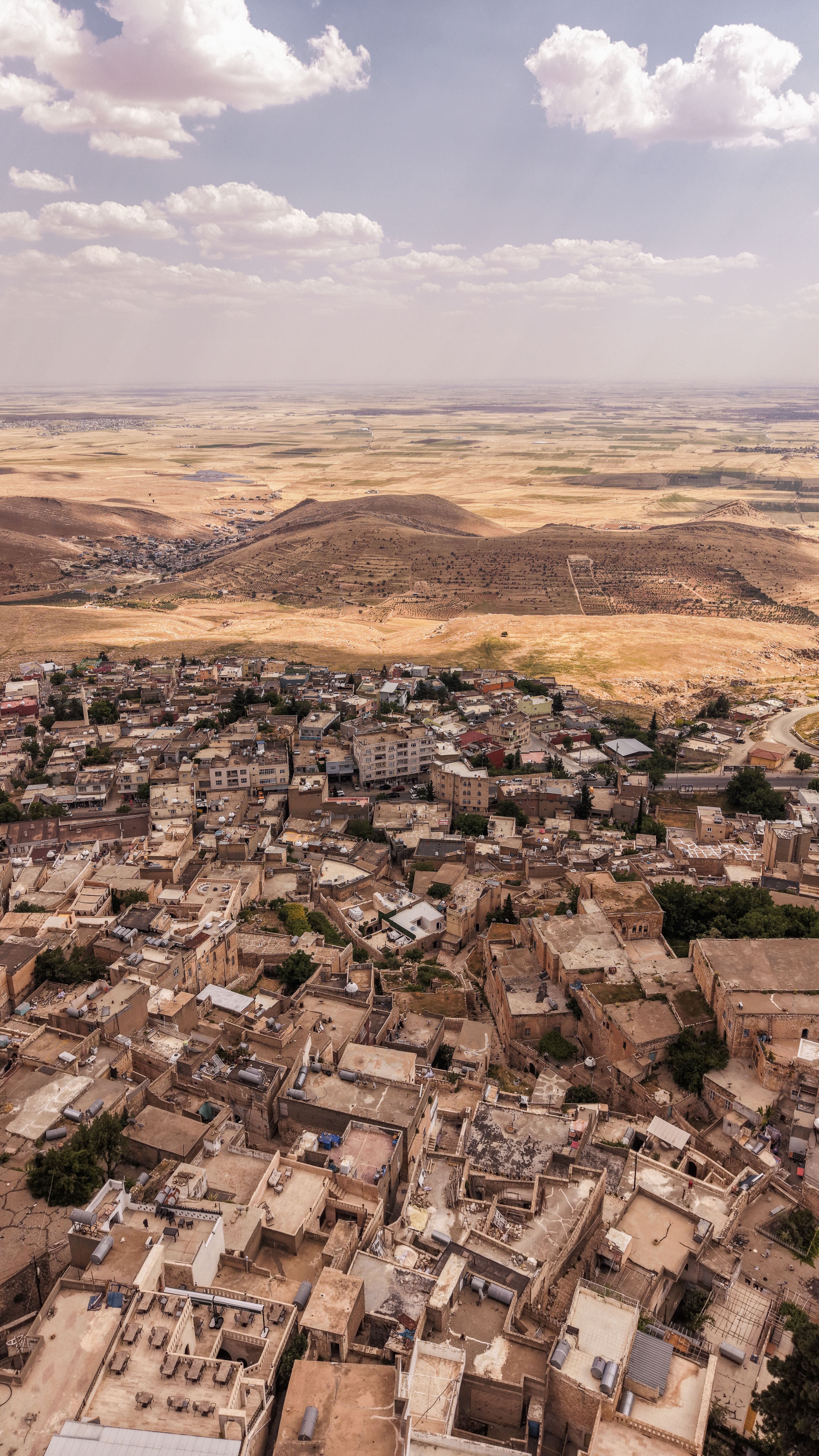 Explore the ancient architecture of Mardin, Türkiye, from above, showcasing its unique landscape and cultural heritage.