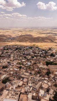Explore the ancient architecture of Mardin, Türkiye, from above, showcasing its unique landscape and cultural heritage.