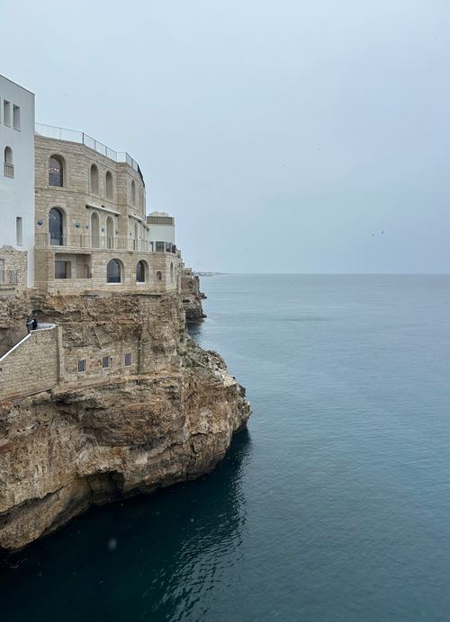 Free Beautiful cliffside architecture overlooking the Adriatic Sea in Polignano a Mare, Italy. Stock Photo