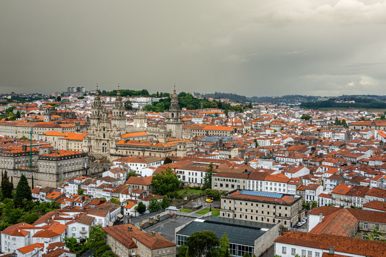 A stunning aerial view of the historic Santiago de Compostela with its iconic cathedral amidst the cityscape.