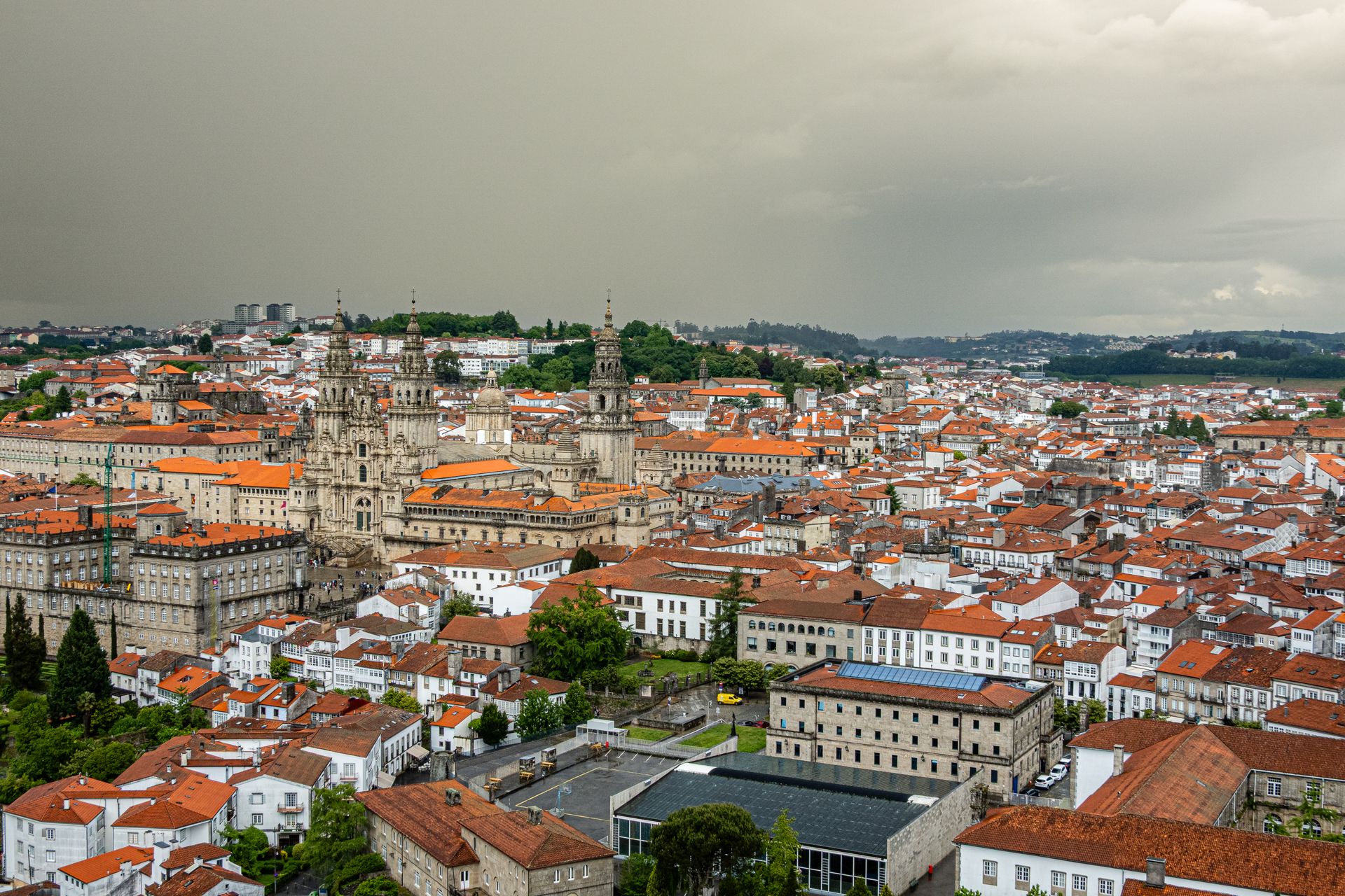 A stunning aerial view of the historic Santiago de Compostela with its iconic cathedral amidst the cityscape.