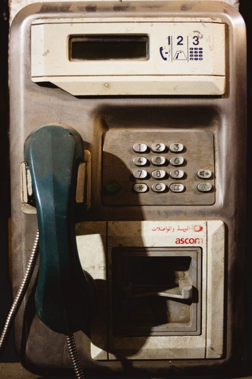 Free A vintage public payphone in Blida, Algeria showcasing nostalgic communication technology. Stock Photo
