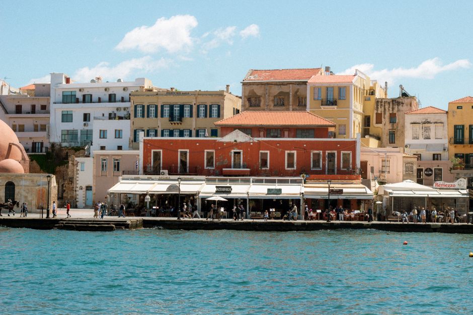 Explore the vibrant architecture of Chania's waterfront with its colorful buildings lining the harbor.