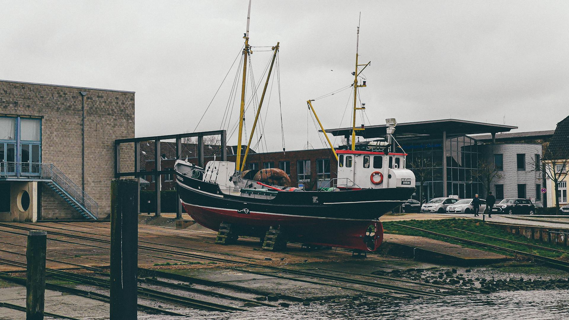 Close-Up Shot of Boat on a Dock near a Building