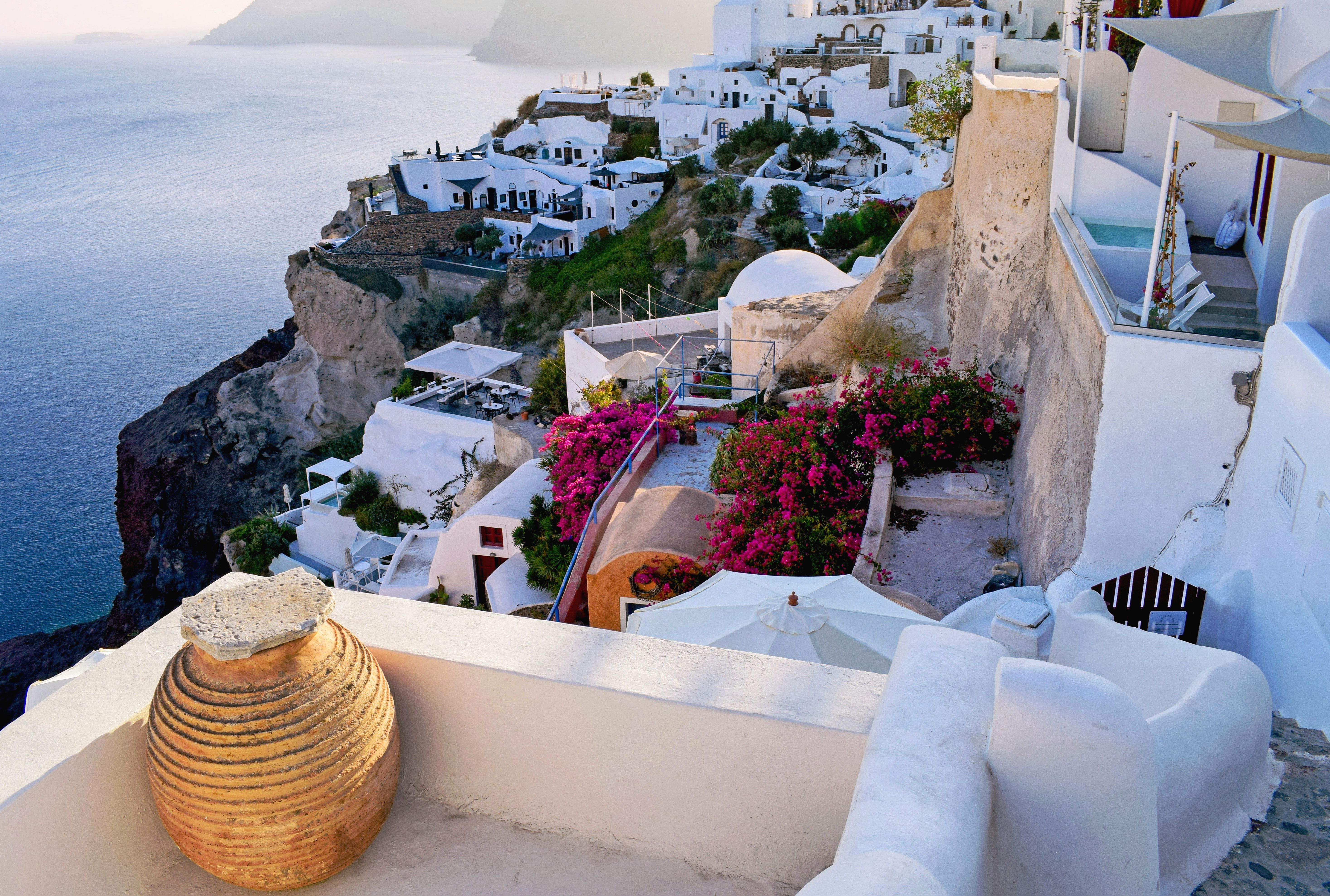 Oia Santorini sunset caldera cliffs white buildings