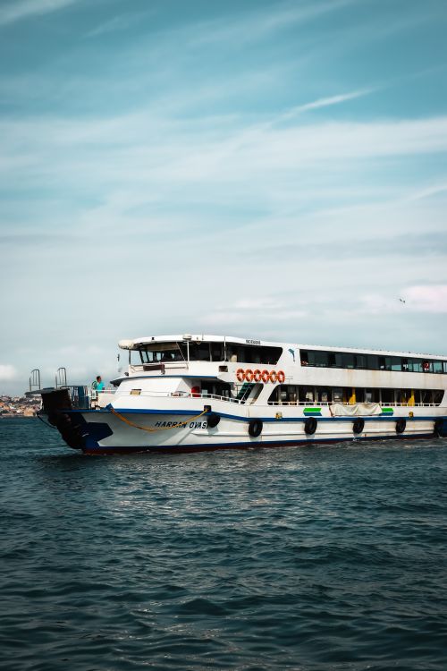 Free Elegant ferry cruising the Bosphorus in İstanbul, Türkiye, with a clear sky backdrop. Stock Photo