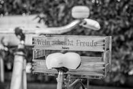 Black and white image of a bicycle with a wooden wine crate in Basel, Switzerland. Artistic and nostalgic vibe.