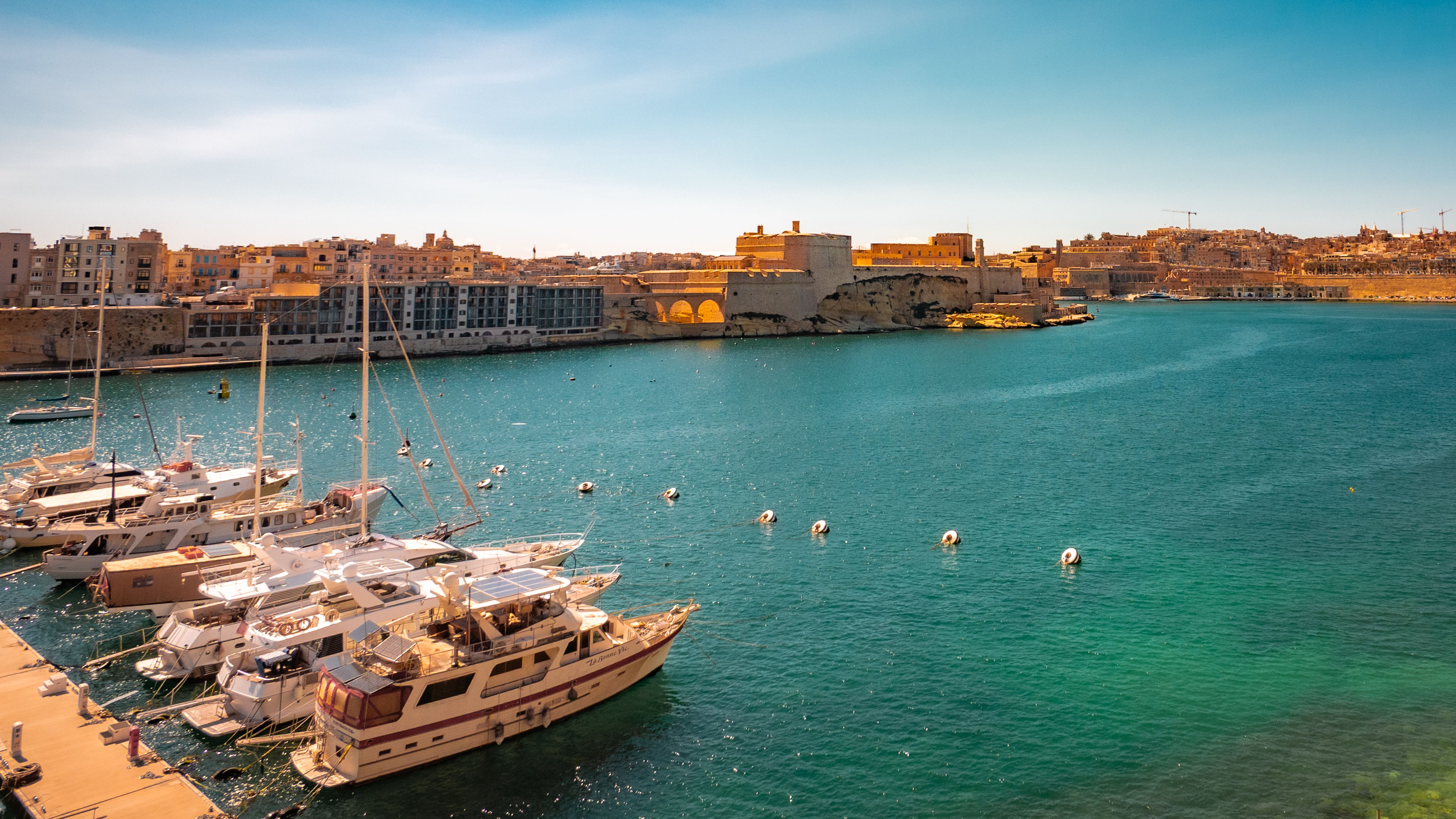 Stunning 2-Day Introduction to Sail Cruising Course in Malta Review: Your Complete Guide to Learning the Ropes Review 2026 - Peaceful marina scene with boats, historic buildings, and vibrant blue waters under a clear sky.