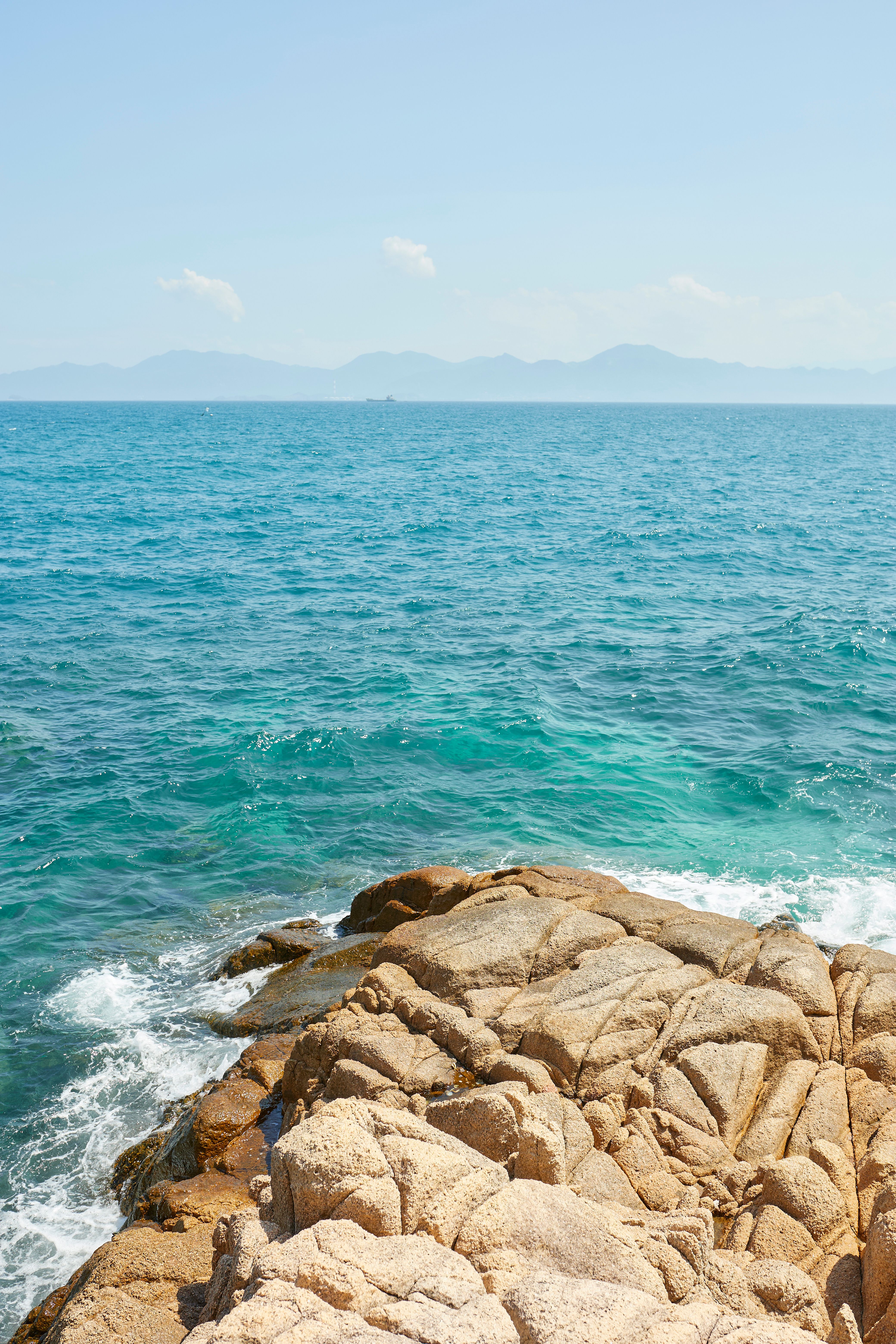 Scenic Rocky Coastline in Vietnam Under Clear Sky