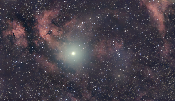 Explore the detailed view of the Swan Nebula with vibrant colors and countless stars.