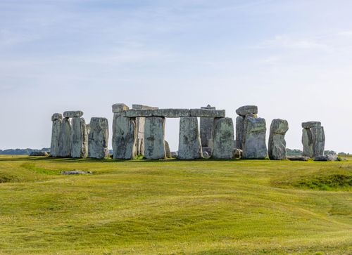 Free A stunning view of Stonehenge in Wiltshire, England, under a clear blue sky. Stock Photo