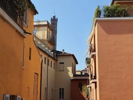 Beautiful alleyway scene in Bologna, showcasing medieval architecture and vibrant facades.