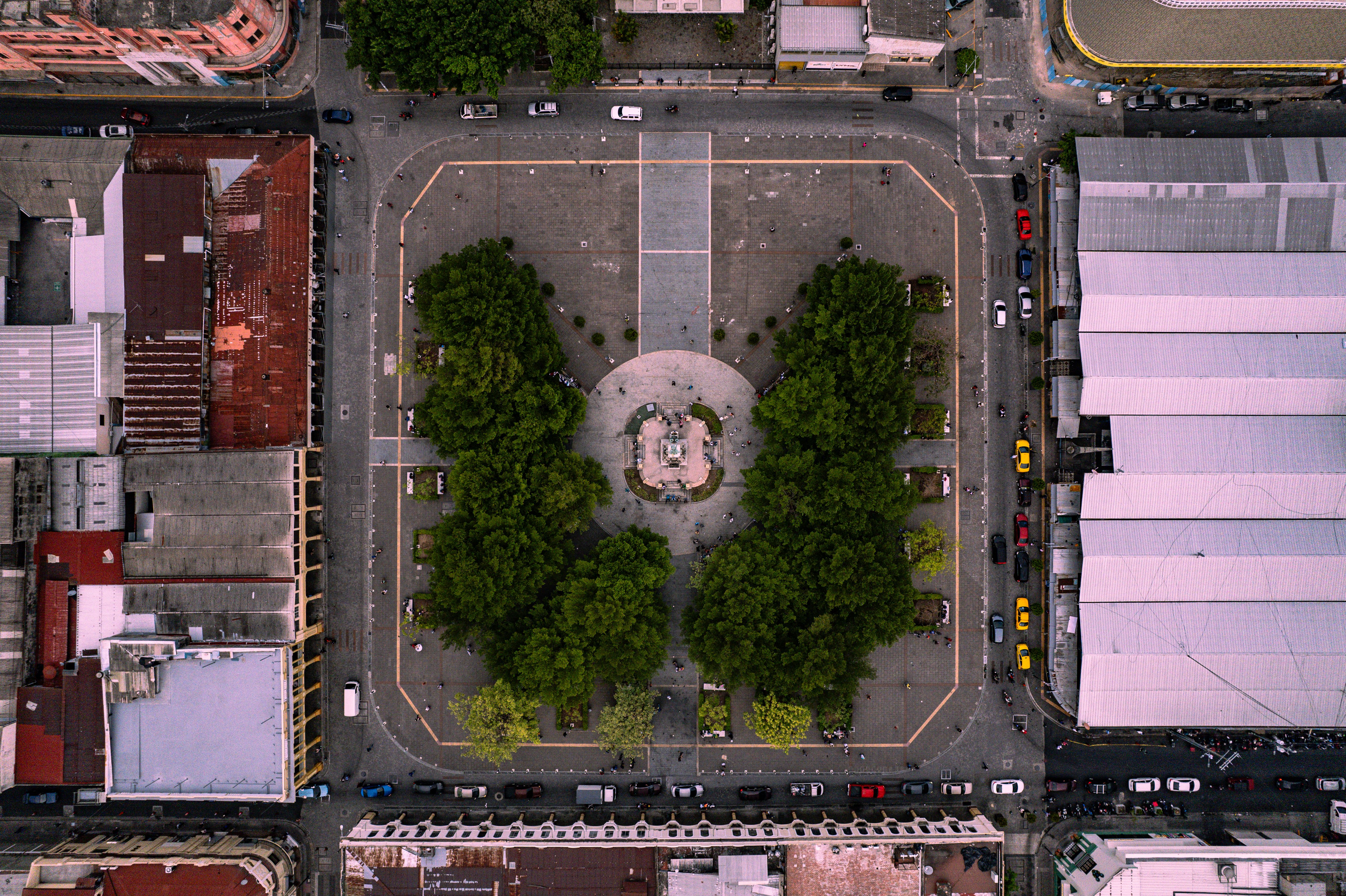 Stunning aerial shot of a historic plaza amidst urban buildings in San Salvador, El Salvador.