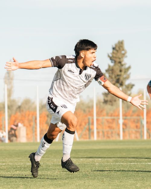 Free A soccer player celebrates a goal on an outdoor field during daytime. Stock Photo