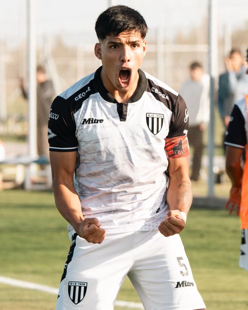Free Soccer player celebrates a goal with excitement on the field. Joyful and energetic expression. Stock Photo