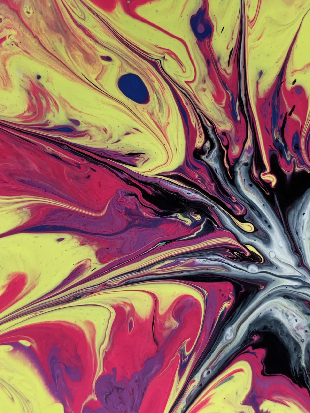 Colorful abstract painting with vibrant acrylic swirls