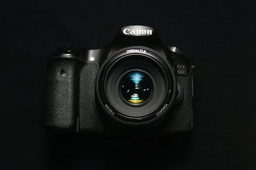 High-quality DSLR camera with zoom lens on a sleek black background. Ideal for photography concepts.