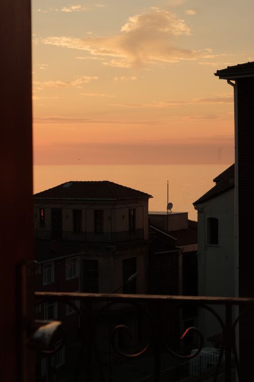 Free Beautiful sunset view over İnebolu, Kastamonu with silhouettes of quaint buildings against the sea. Stock Photo