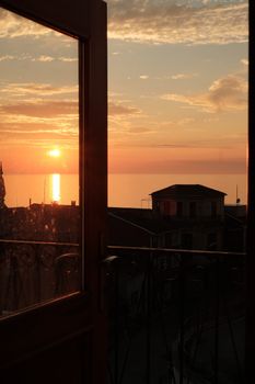 Beautiful sunset through a window in İnebolu, Kastamonu, Türkiye overlooking the sea.