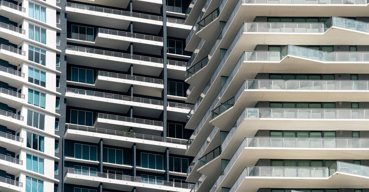 Close-up view of contemporary skyscrapers in Miami, showcasing geometric balconies and urban design.