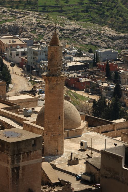 Free Aerial shot of a historical minaret in Mardin, showcasing Middle Eastern architecture. Stock Photo