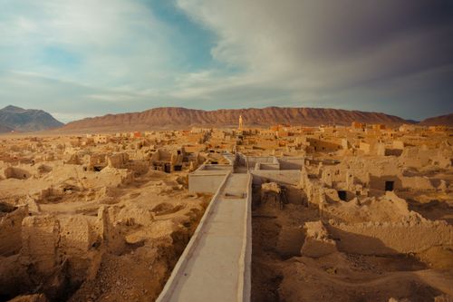 Free A captivating view of an ancient desert village set against Morocco's arid mountains. Stock Photo
