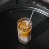 Iced coffee with a metal straw — Elle Kwee on Pexels
