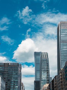A striking view of Beijing's skyline featuring modern skyscrapers and clear blue skies.
